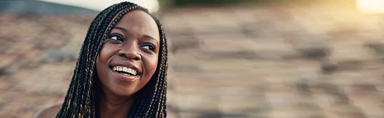 Smiling woman with a braided hairstyle