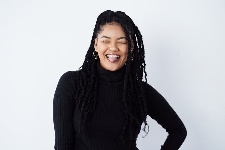 Smiling woman with a long braided hairstyl