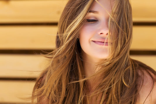 Smiling woman with long brown hair