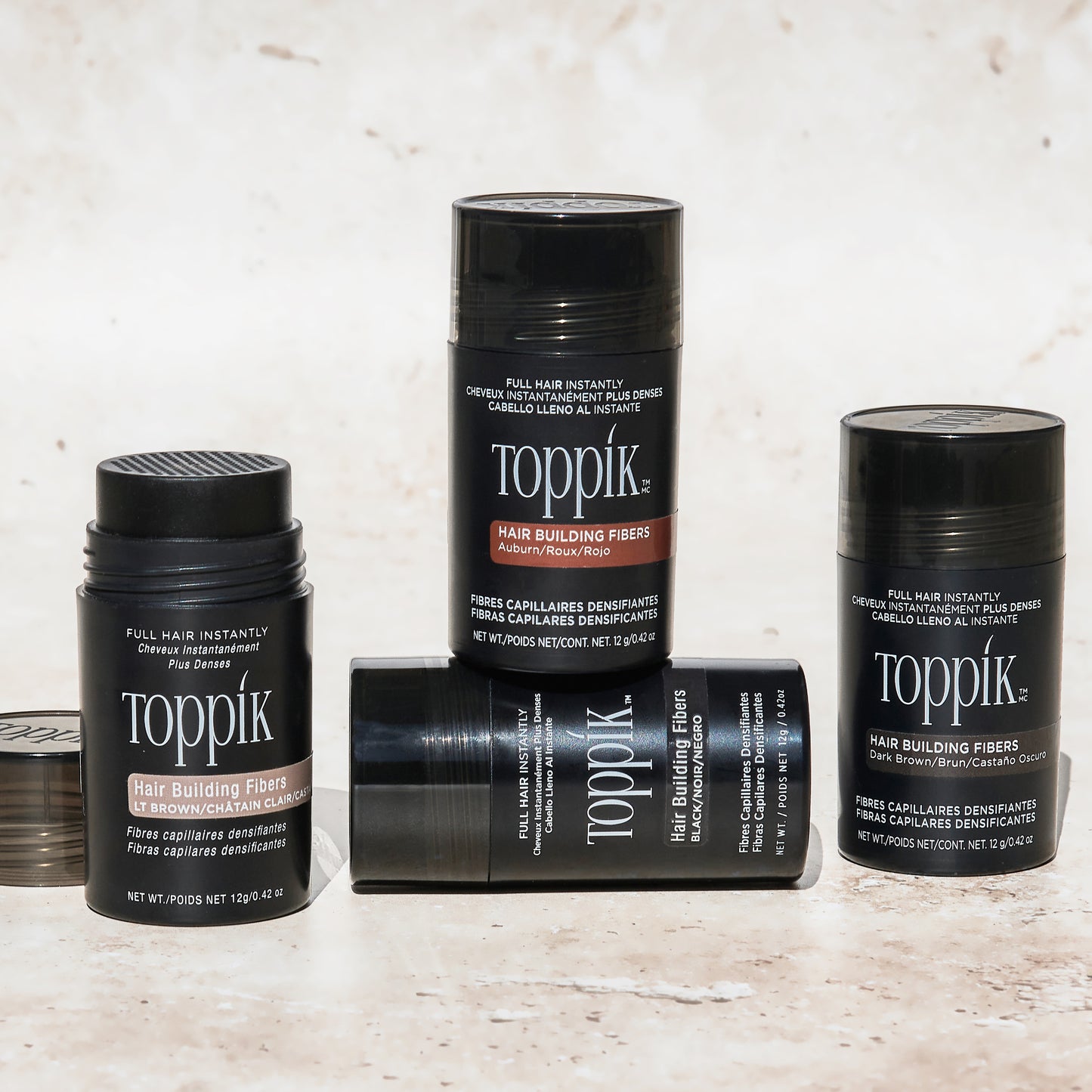 Toppik hair building fibers bottle in variety of color shades