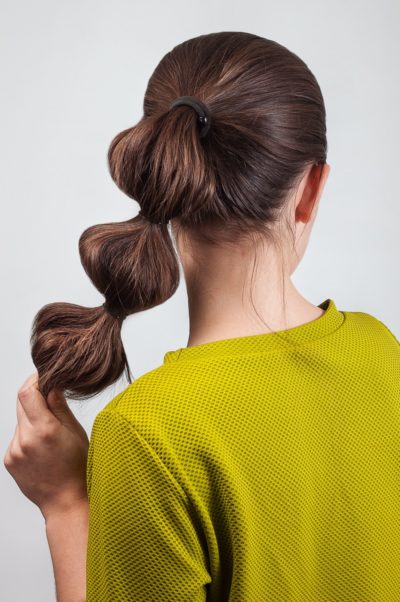 bubble-ponytail-long-hair-brunette-woman-best-gym-hairstyles