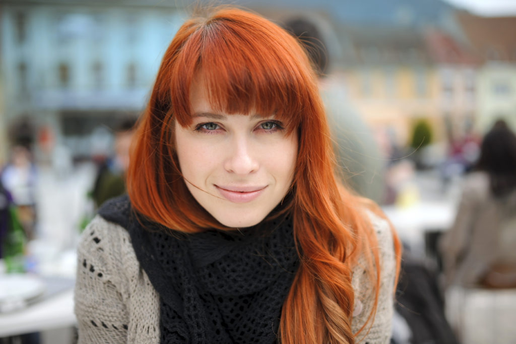redhead bangs woman long oblong face hairstyles face shapes toppik blog post