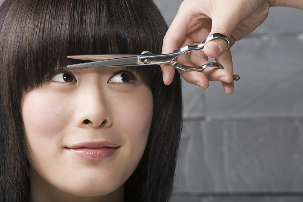 haircut bangs asian woman closeup face smiling best bangs for thin hair toppik hair blog